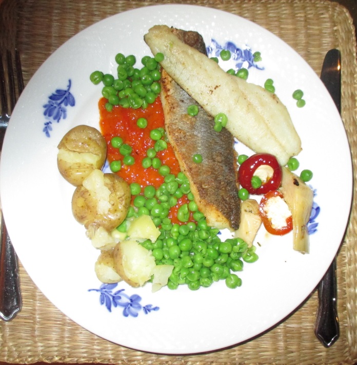 pan-fried sea bass fillets with spicy Lutenzia peas and crushed potatoes
